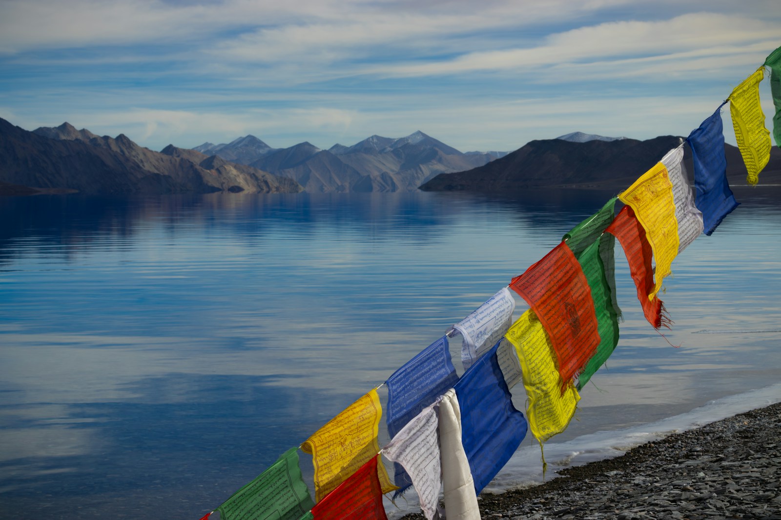 a colorful stream of streamers hanging over a body of water