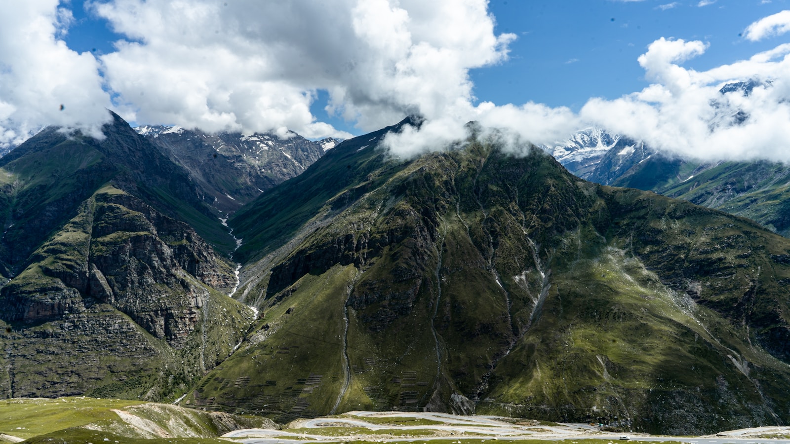 a mountain range with clouds