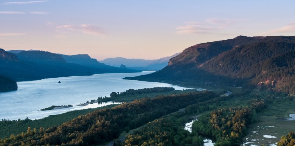 a body of water surrounded by hills