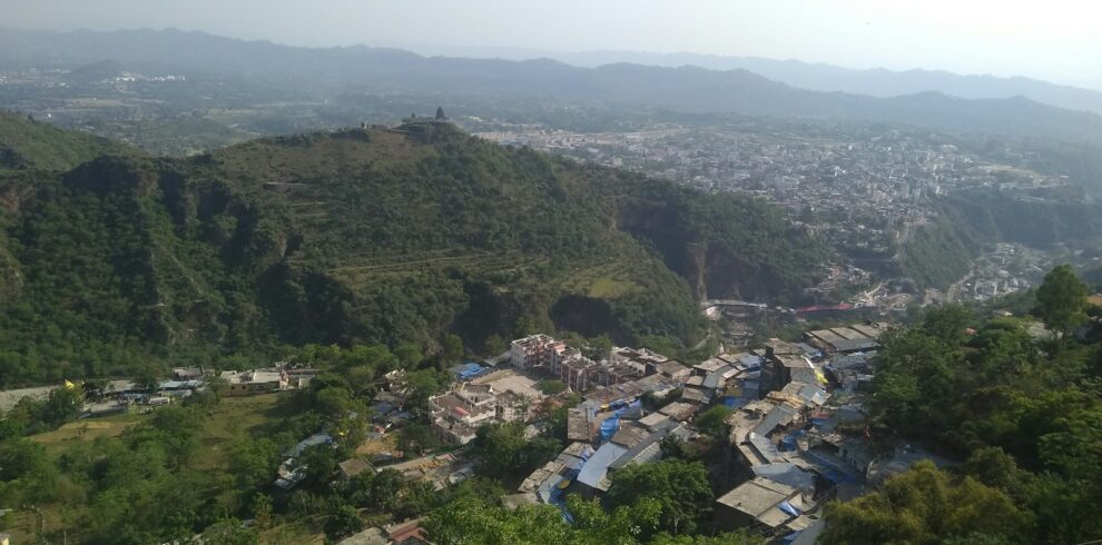 a view of a small village in the mountains