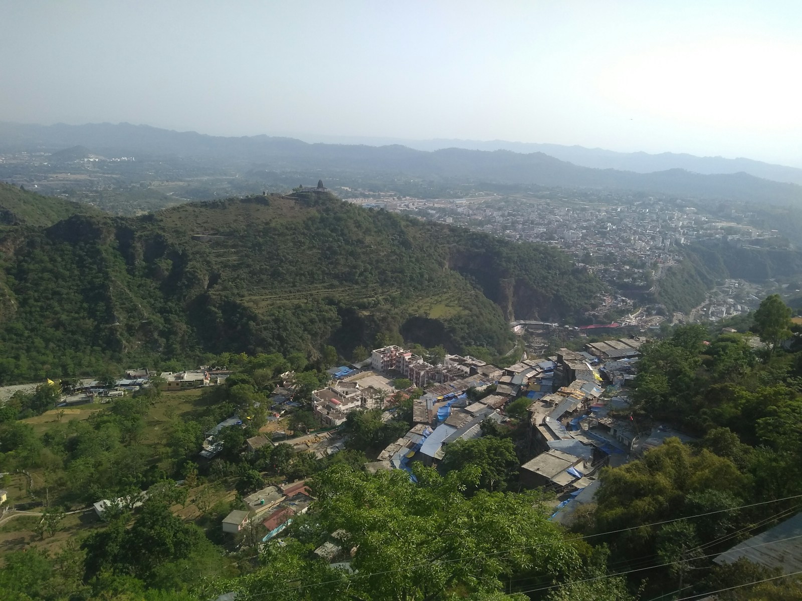 a view of a small village in the mountains