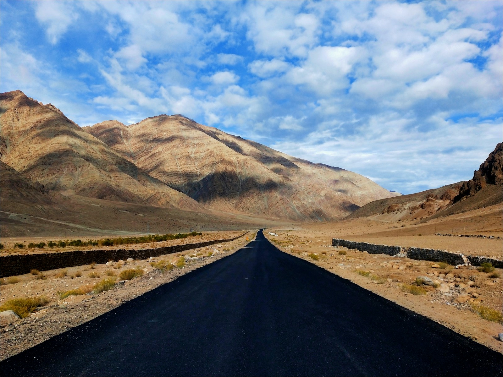 a long road in the middle of a desert